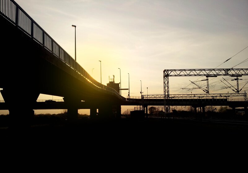 Silhouetted bridges at sunset
