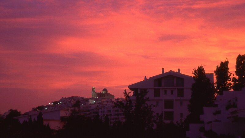 Silhouetted Buildings at Dusk — Red