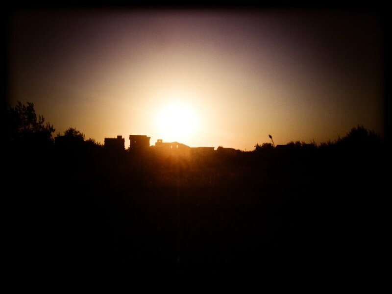 Silhouetted Buildings at Sunset — Black