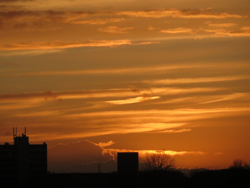 Silhouetted Buildings at Sunset — Orange, Dramatic