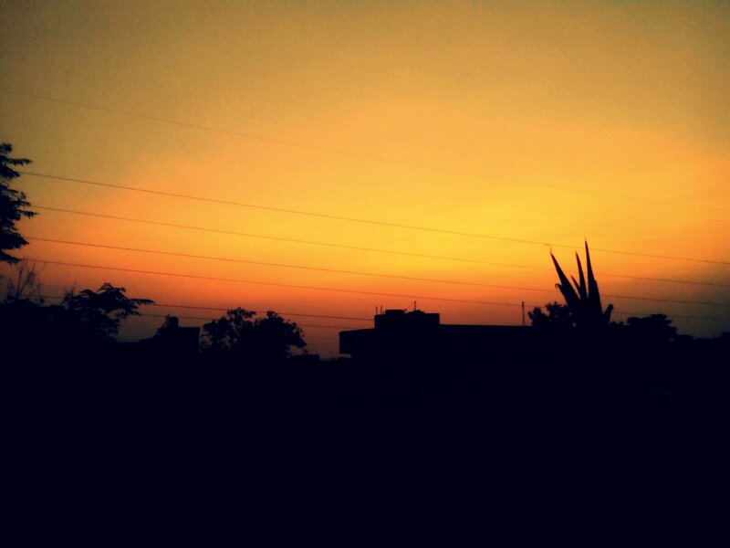 Silhouetted Buildings at Sunset — Orange, Serene