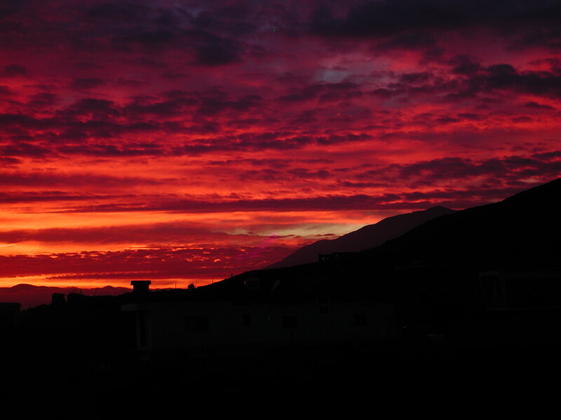 Silhouetted Buildings at Sunset — Red