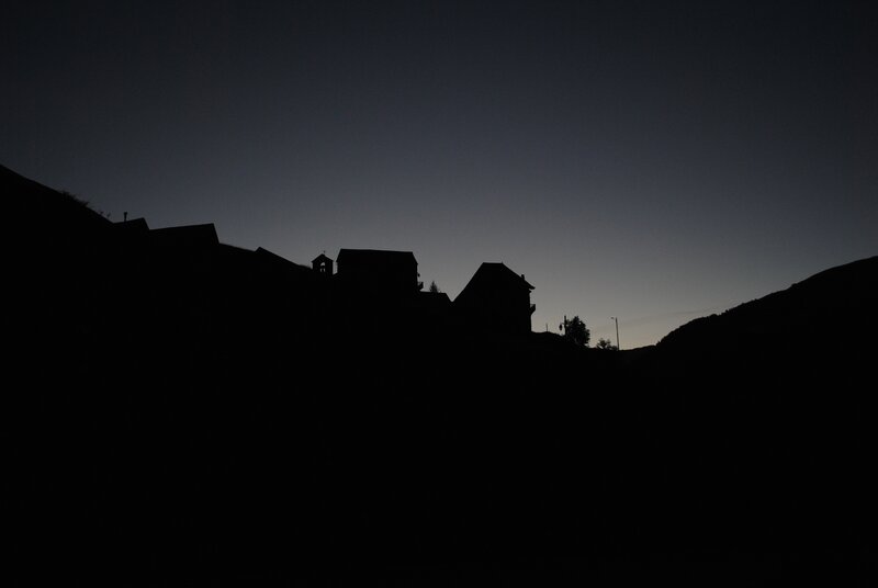 Silhouetted Buildings on Hill