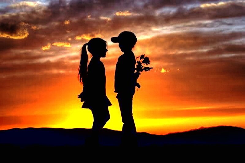 Silhouetted Children at Sunset — Orange