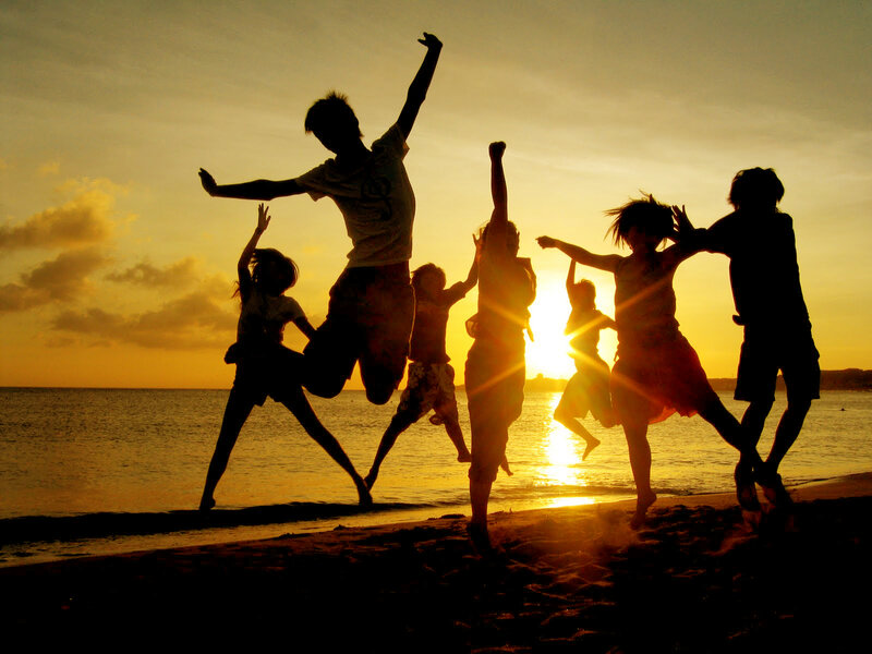 Silhouetted Children Jumping