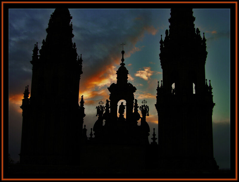Silhouetted church towers at sunset