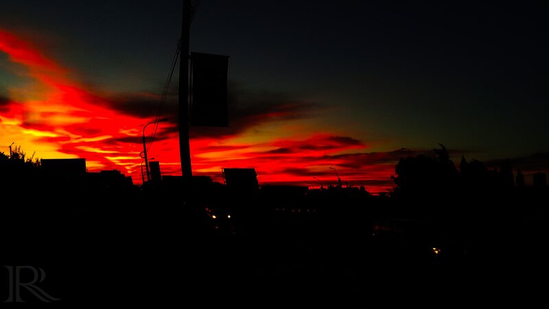 Silhouetted City at Sunset — Red