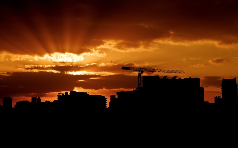 Silhouetted City Skyline — Orange