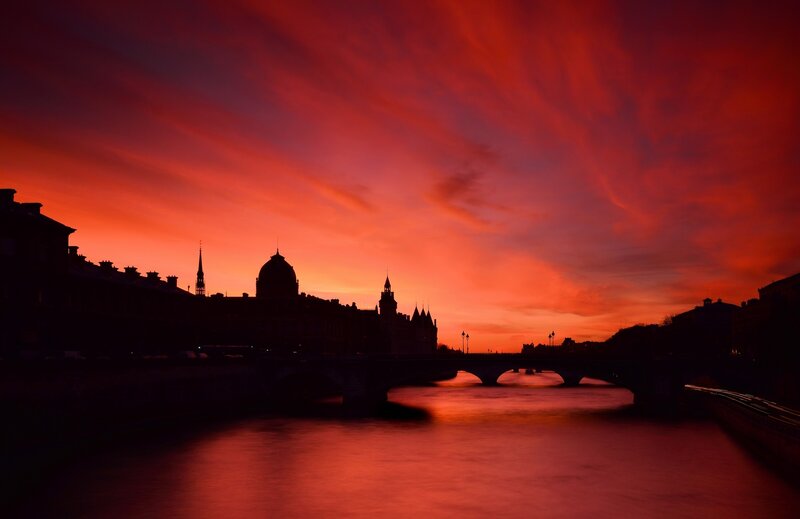 Silhouetted City Skyline — Red