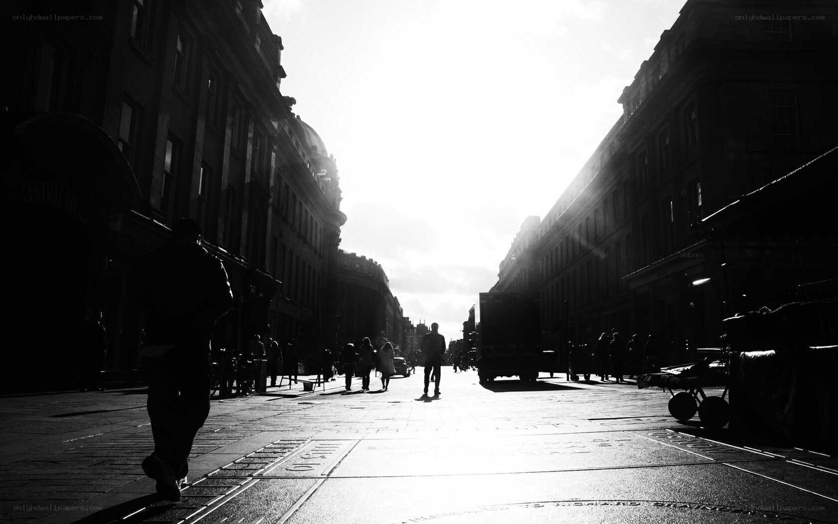 Silhouetted city street at sunset