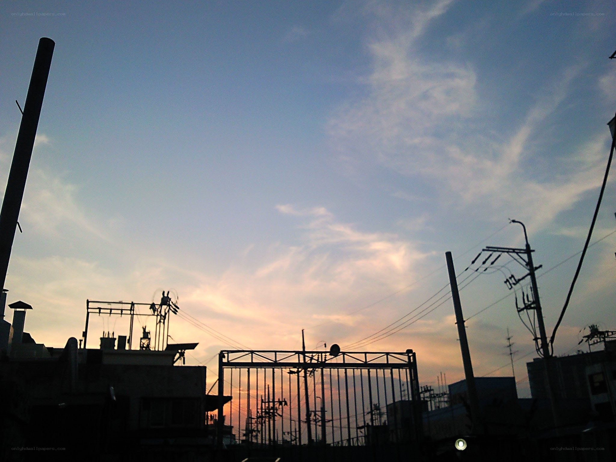 silhouetted cityscape at dusk
