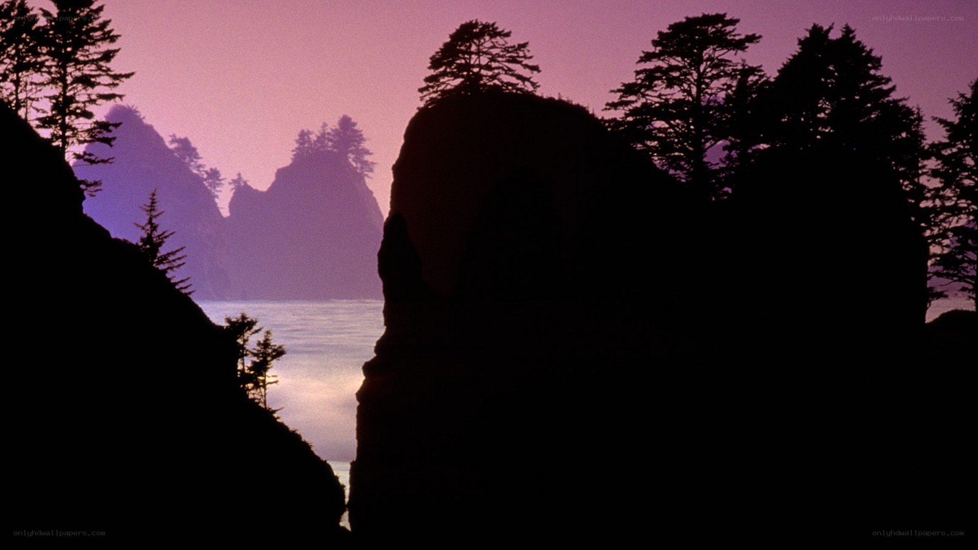 silhouetted cliffs at dusk