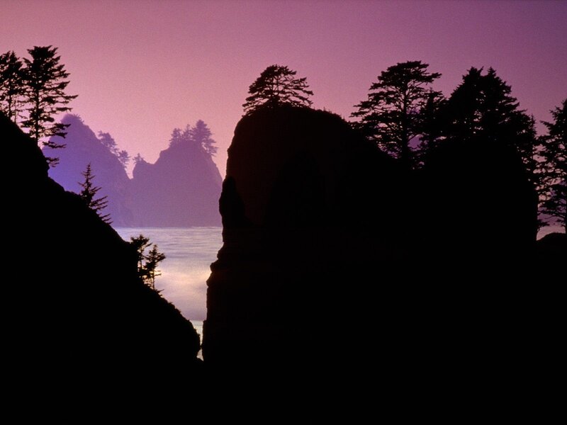 silhouetted cliffs at dusk