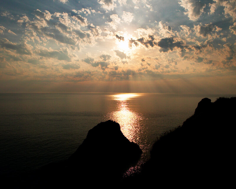 Silhouetted Cliffs at Sunset — Gold