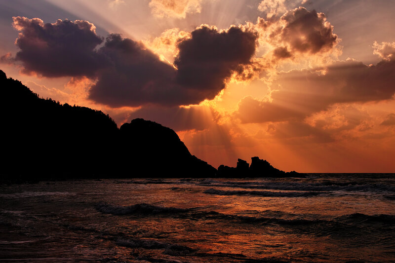 Silhouetted Cliffs at Sunset — Orange, Dramatic
