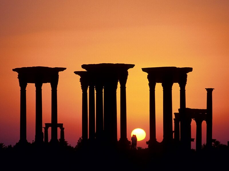 Silhouetted Columns at Sunset — Orange