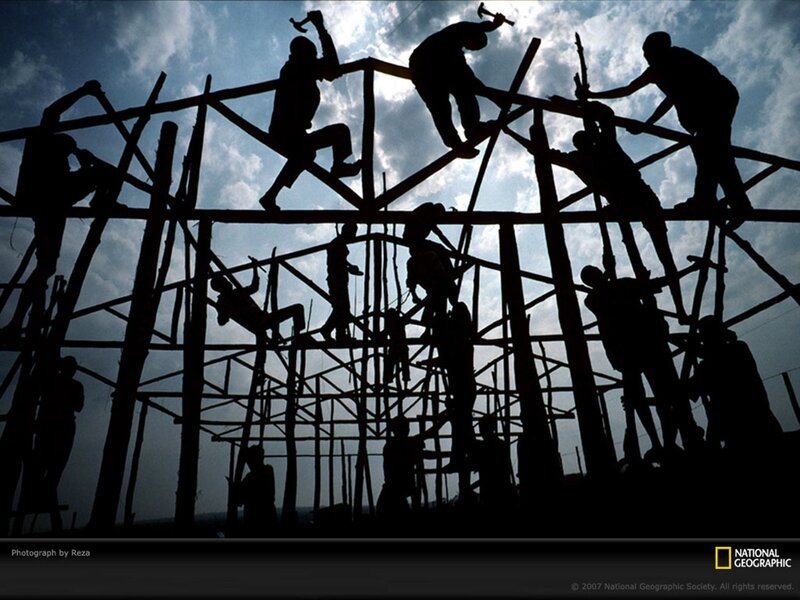 Silhouetted construction workers