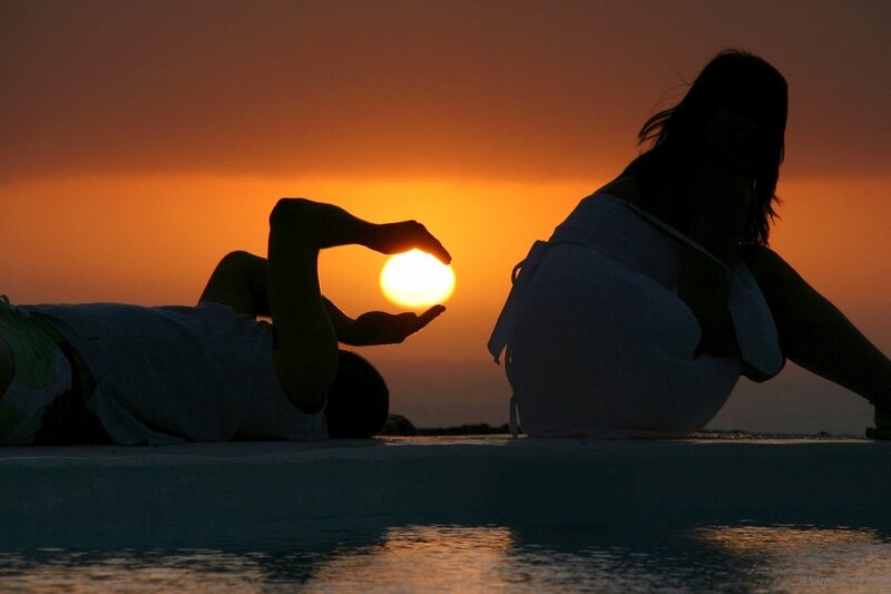 Silhouetted Couple at Sunset — Orange, Serene