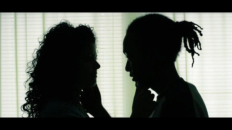 silhouetted couple in intimate moment