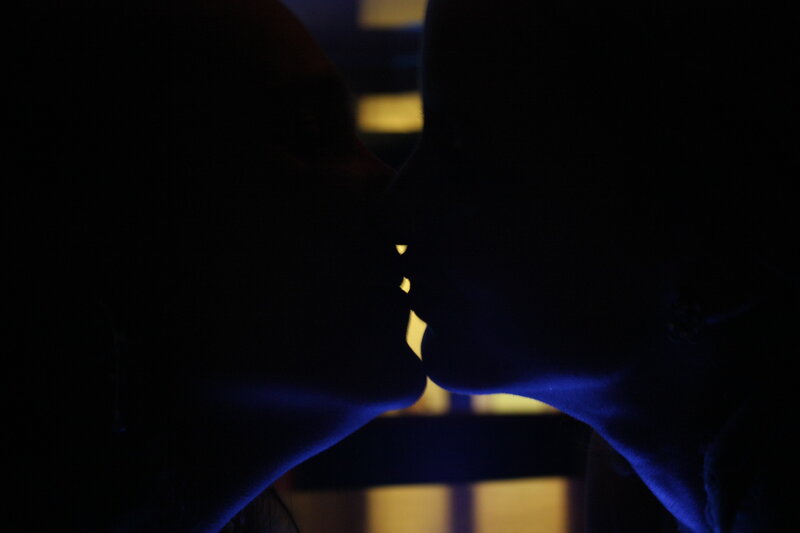 silhouetted couple kissing