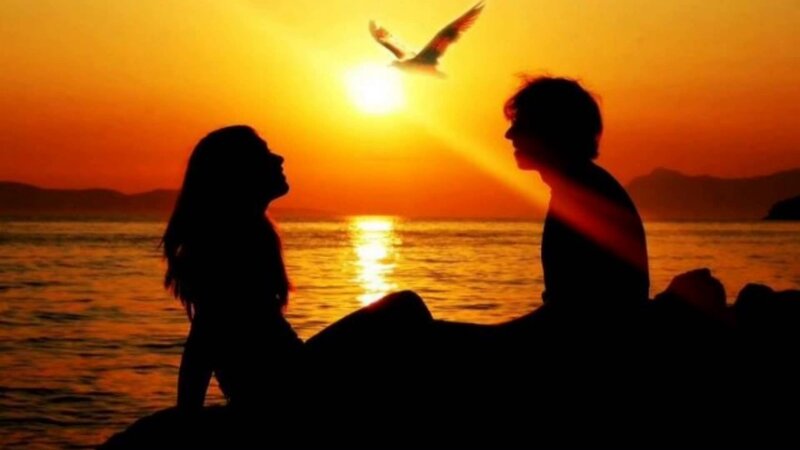 Silhouetted Couple on Beach — Orange, Serene, Sunset