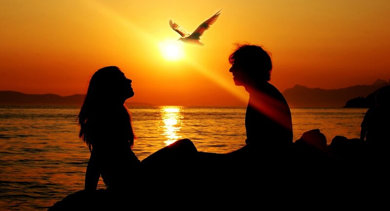 Silhouetted Couple on Beach — Orange, Serene