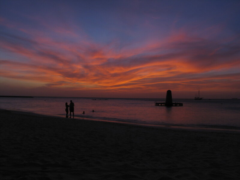 Silhouetted Couple on Beach — Orange