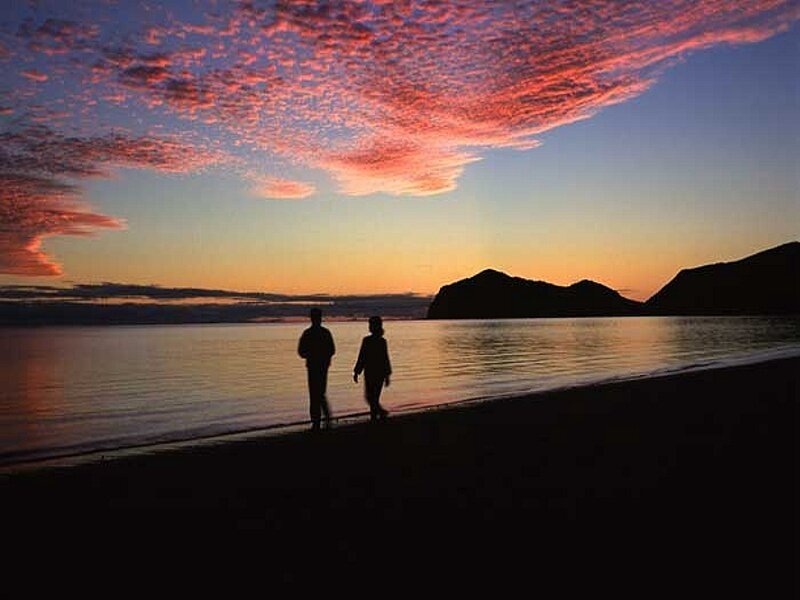 Silhouetted Couple on Beach