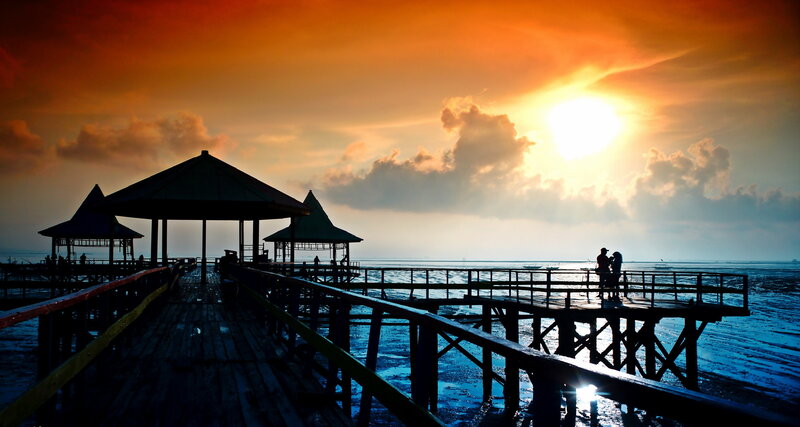 Silhouetted Couple on Pier — Orange