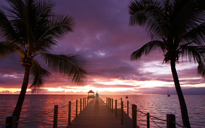 Silhouetted Couple on Pier