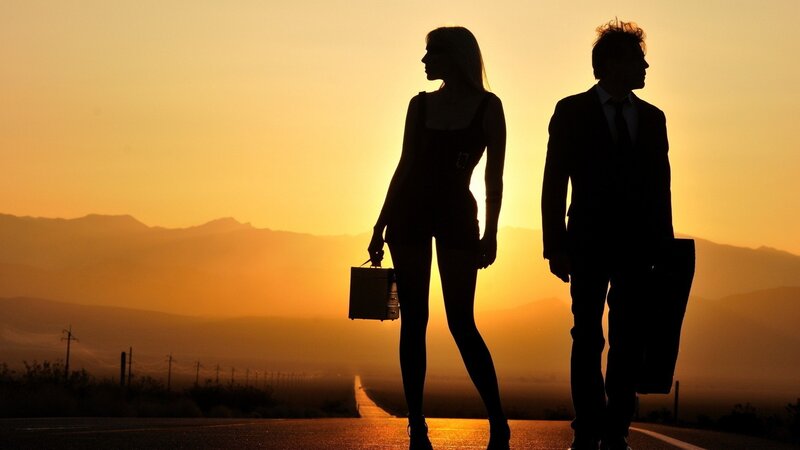 Silhouetted Couple on Road — Orange, Dramatic