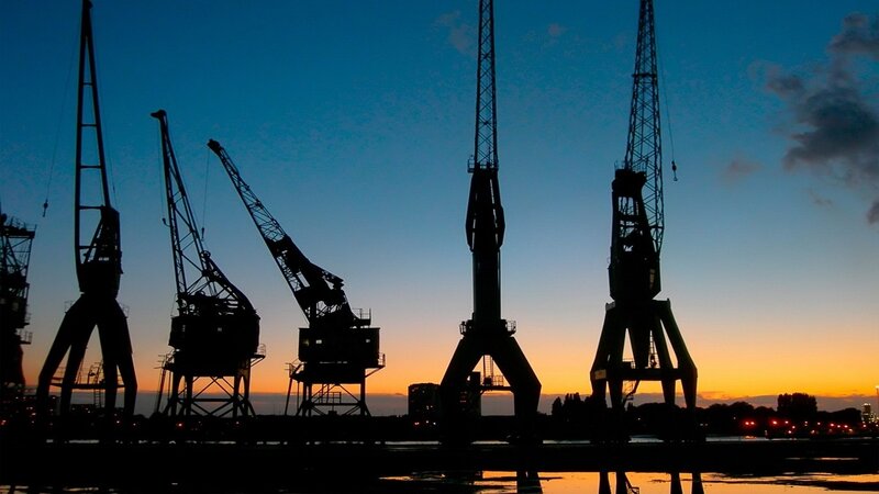Silhouetted Cranes at Dusk — Blue, Dramatic