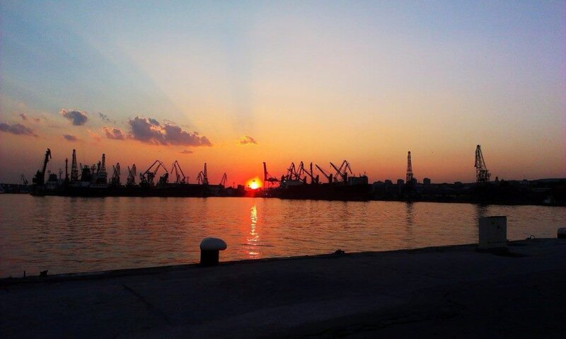 Silhouetted Cranes at Sunset — Orange