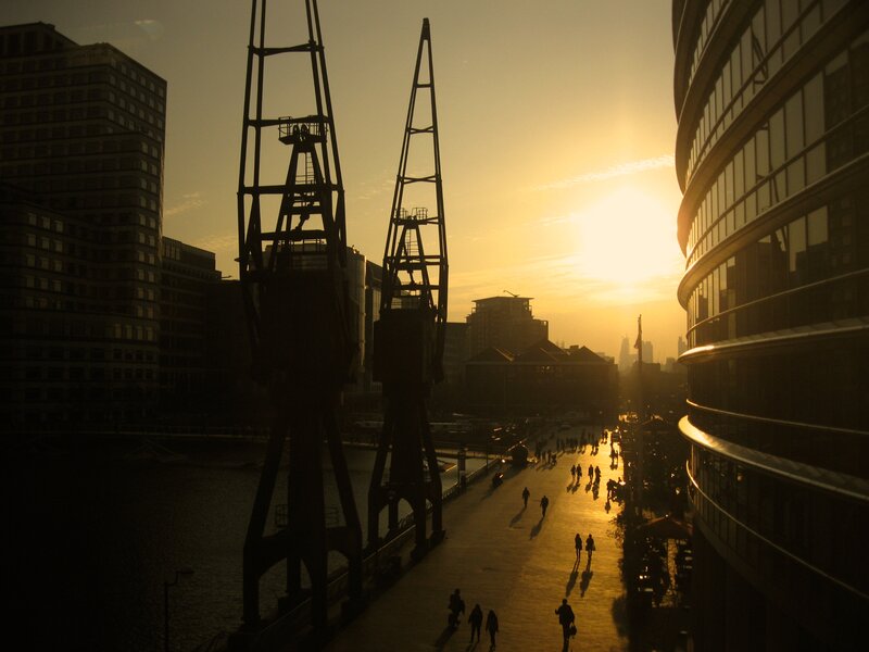 Silhouetted Cranes at Sunset — Yellow