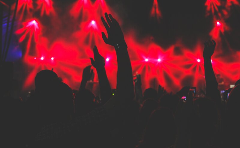 Silhouetted Crowd at Concert — Red, Energetic