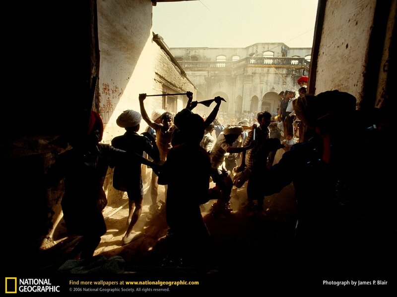 Silhouetted crowd in alleyway