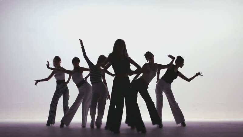 silhouetted dancers in motion