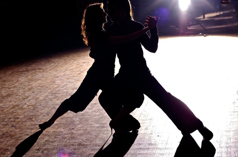 Silhouetted Dancers on Stage