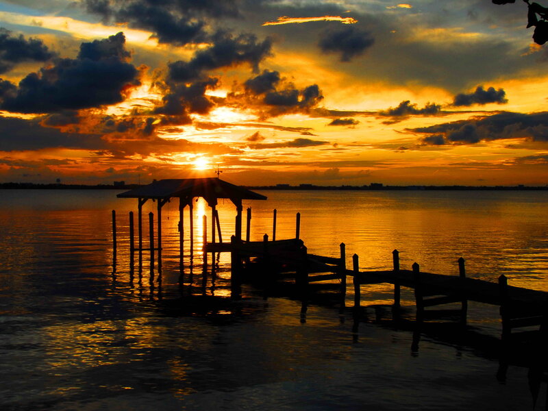 Silhouetted Dock at Sunset — Orange