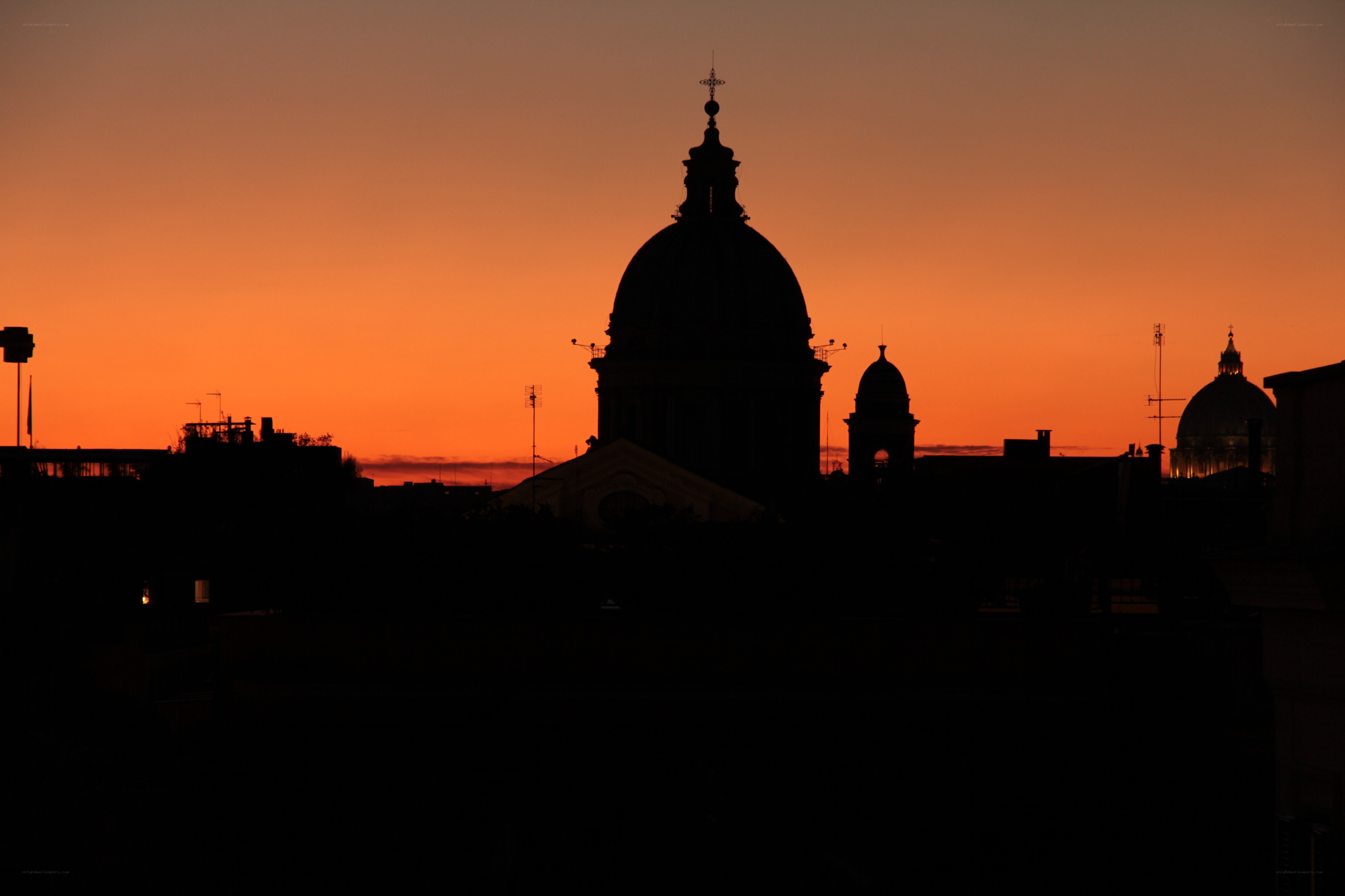 Silhouetted domes at sunset