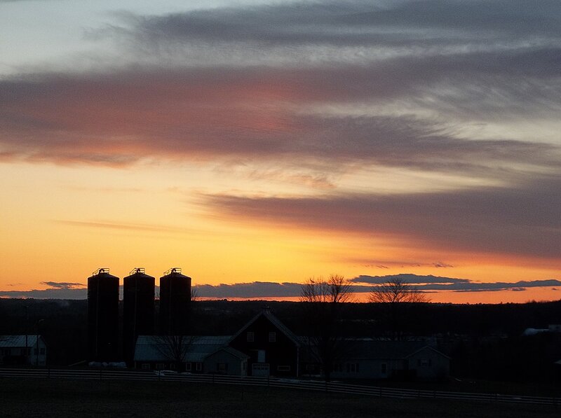 Silhouetted Farm at Sunset