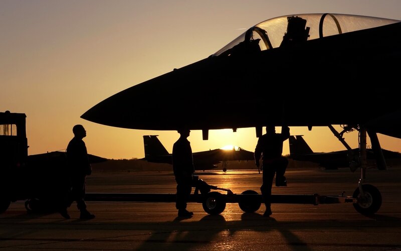Silhouetted Fighter Jet — Orange