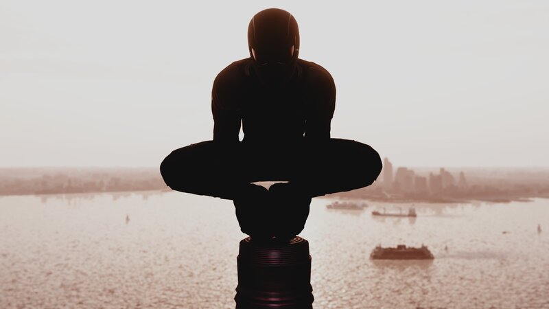 Silhouetted Figure on Pole