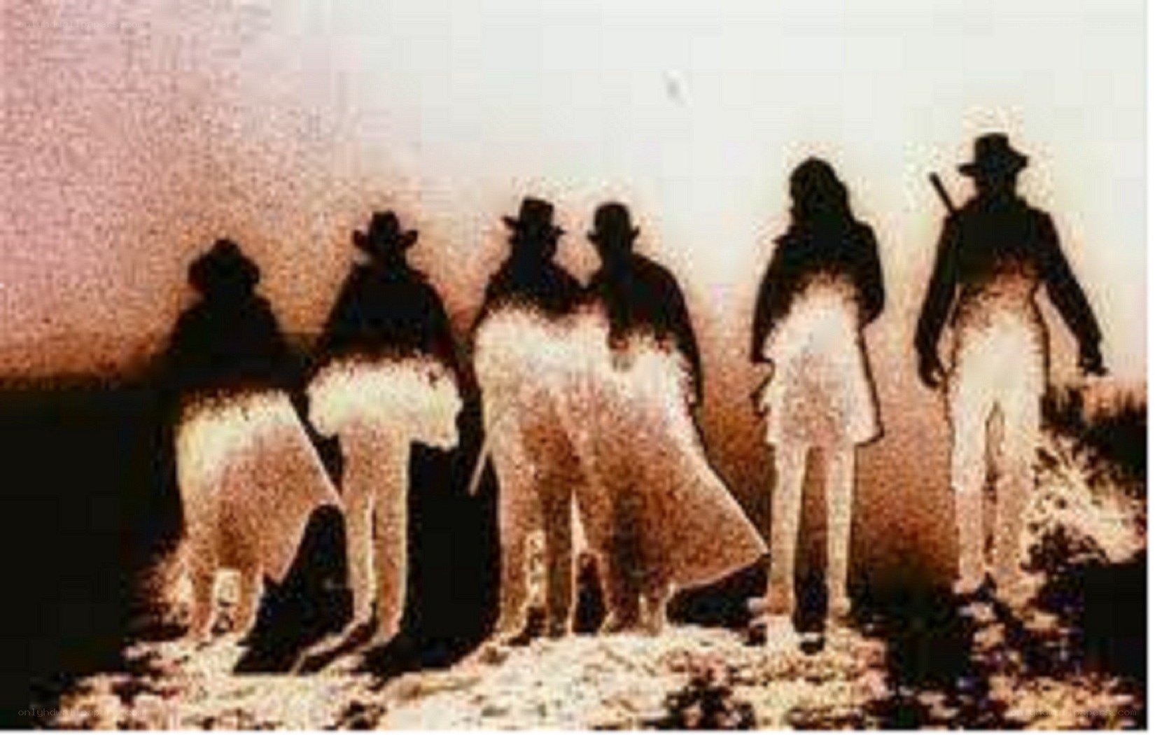 silhouetted figures in a desert scene