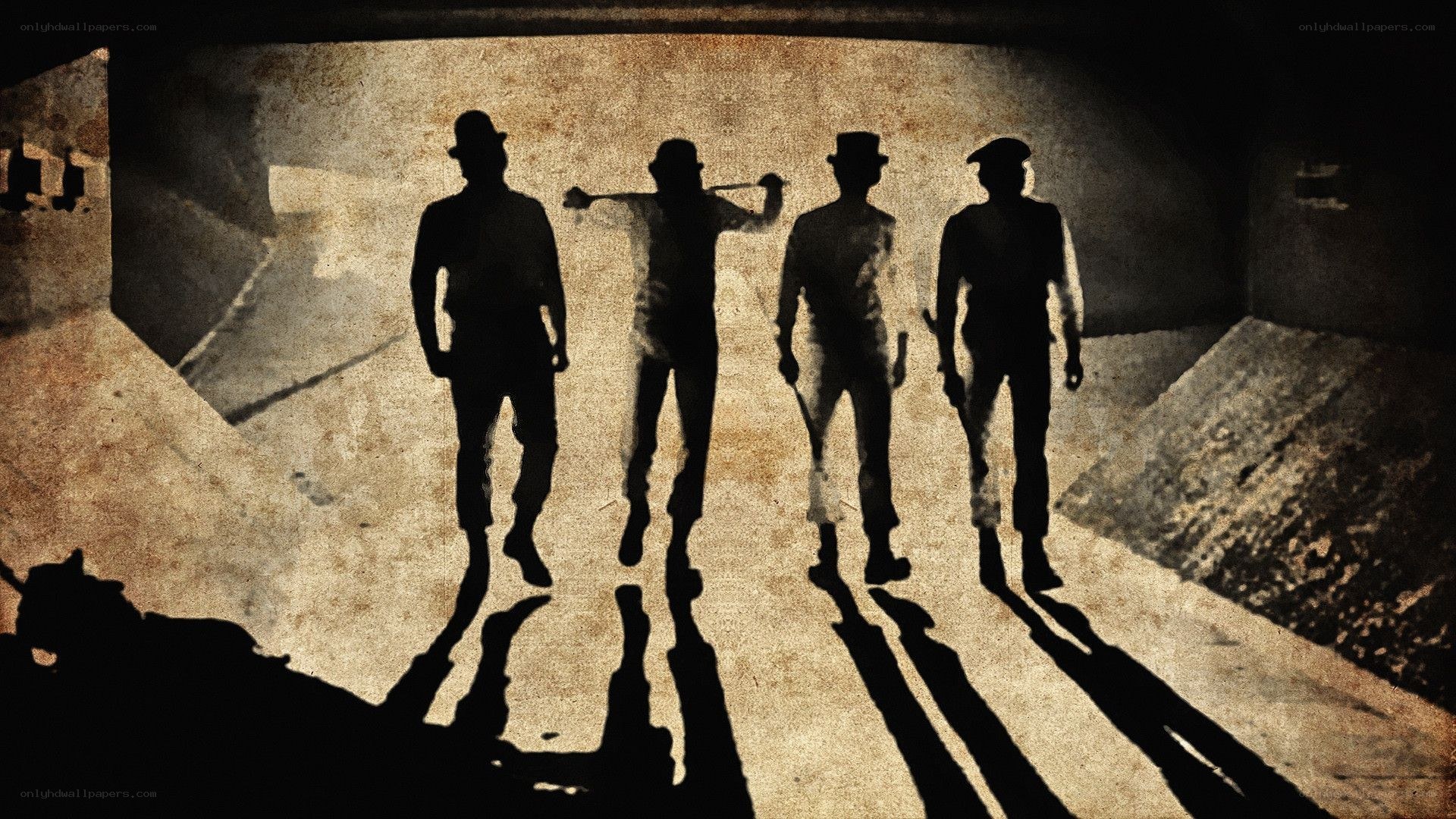 silhouetted figures in a tunnel