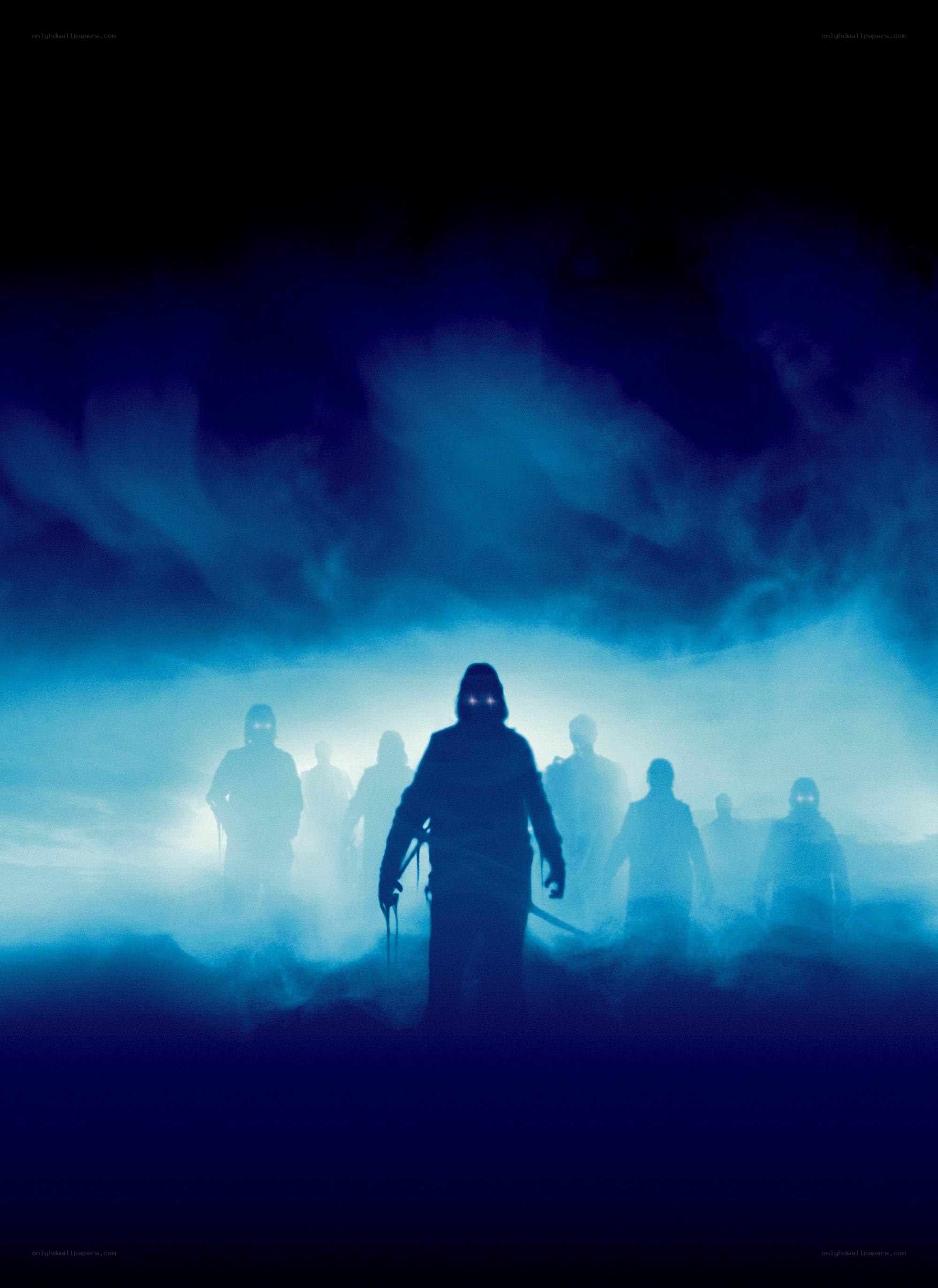 silhouetted figures in blue mist