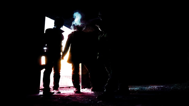 Silhouetted Figures in Doorway