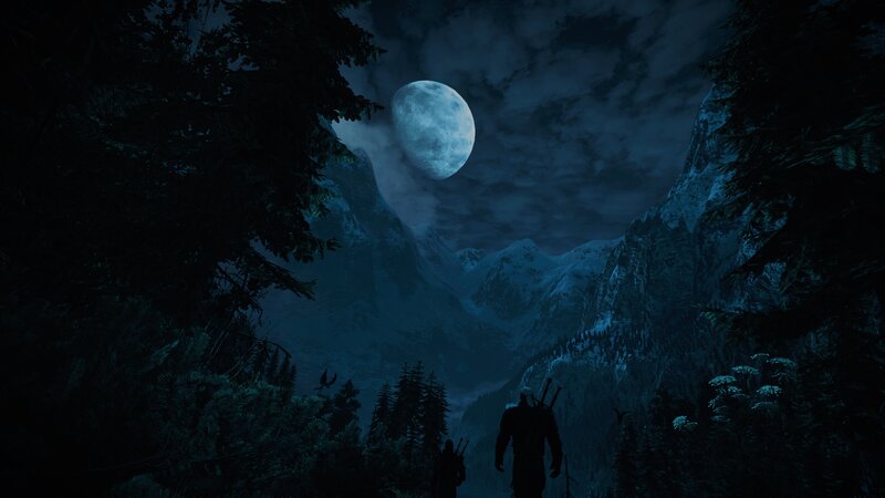 Silhouetted Figures in Mountains