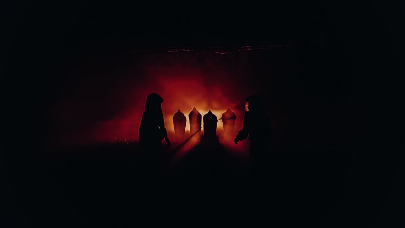 Silhouetted Figures in Red Light — Black
