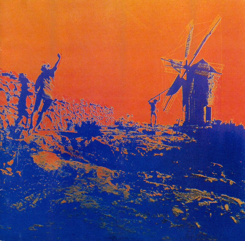 Silhouetted Figures Near Windmill